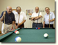 senior citizens playing pool